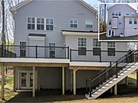 <b>Trex Transcend Island Mist Decking with Black Ultralox Aluminum Railing and White VInyl Fascia around perimeter of deck in Arnold MD</b>